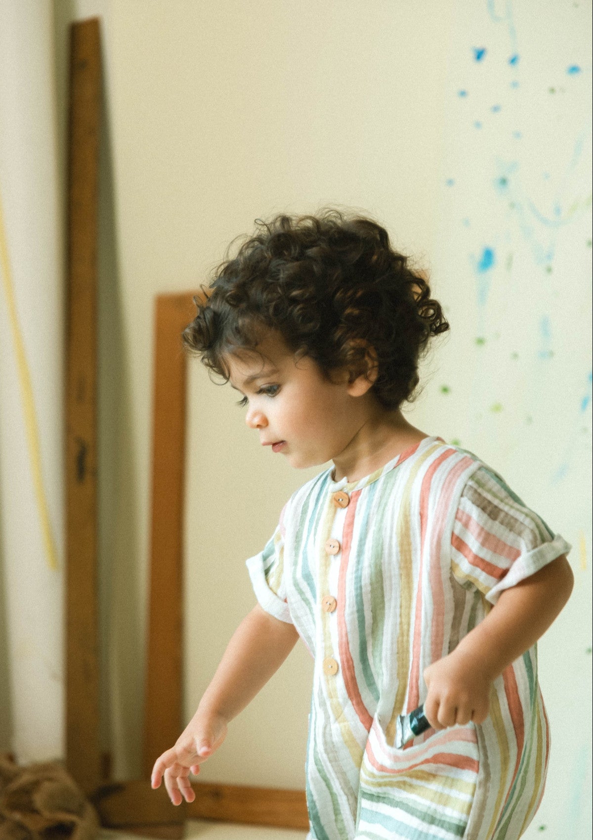 Macacão de riscas multicolor - SNUG